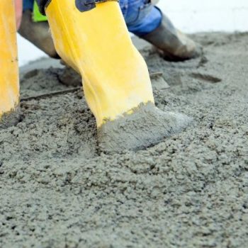 Mackay Concreters wearing rubber boots poured an exposed aggregate driveway in Nindaroo
